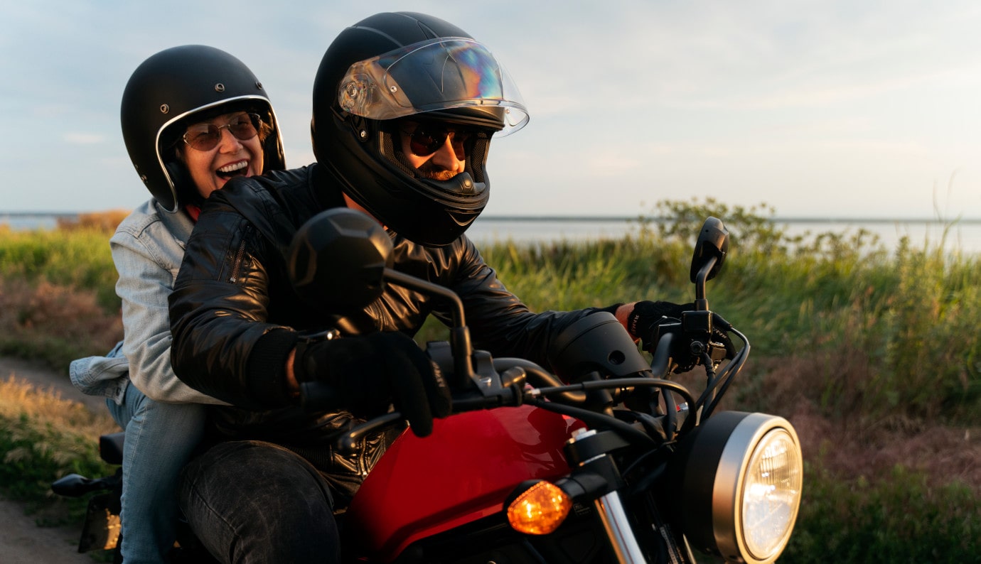 A couple riding their motorcycle with a motorcycle Loan from Finex Credit Union