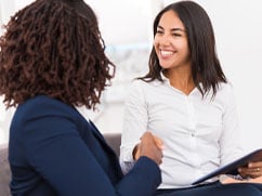 Woman-shaking-hands-with-mortgage-expert-at-Finex-after-receiving-customized-trustworthy-advice.