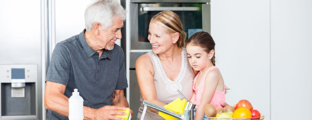 Family smiling in kitchen