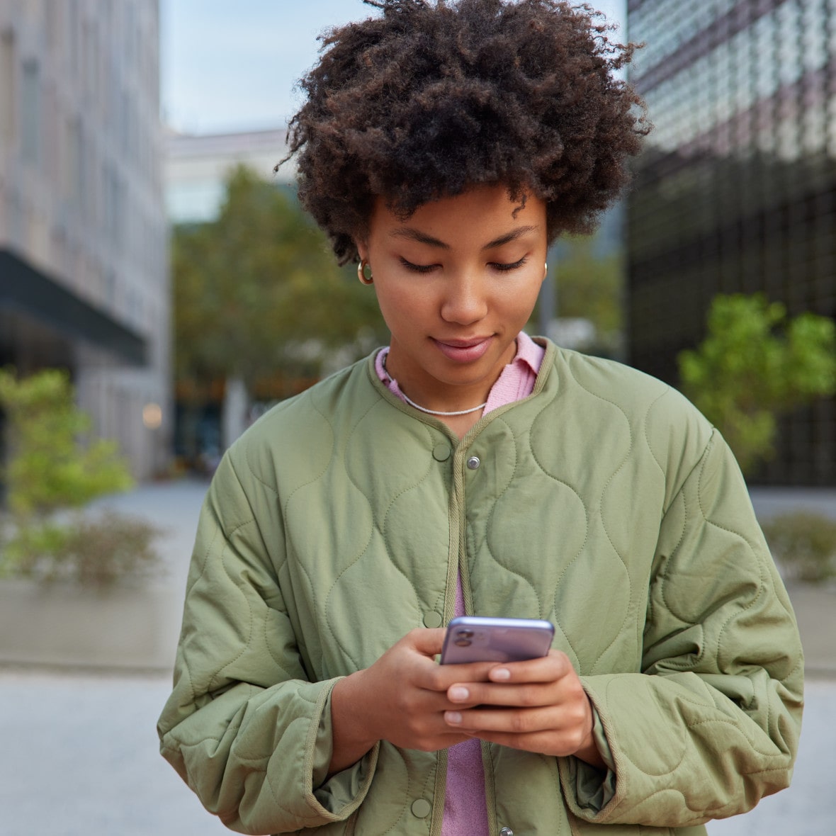 young woman using the Finex Credit Union mobile banking app