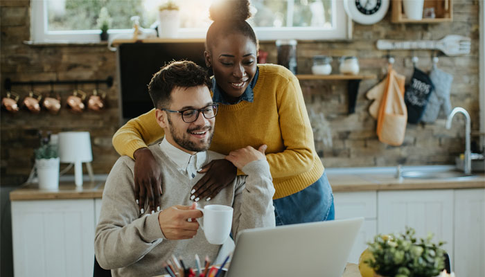 Finding the best checking account will make you smile like this couple when banking. 